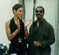 Eddie looking at crowd with wife Nicole